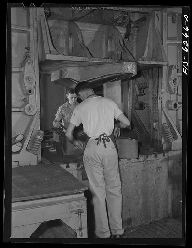 Nashville, Tennessee. Stamping out fuselage parts with a drop hammer. Vultee Aircraft Corporation plant