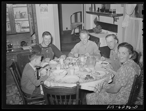 Vernon County, Wisconsin. Saugstad family at dinner, Left to right: Teddy, aged ten; Alton Lee, hired man; Robert, aged sixteen; Mrs. and Mr. Saugstad