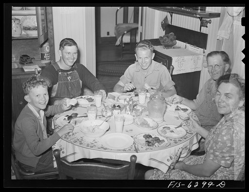 Untitled photo, possibly related to: Vernon County, Wisconsin. Saugstad family at dinner. Left to right: Teddy. Aged ten; Alton Lee, hired man; Robert, aged sixteen, Mr. and Mrs. Saugstad