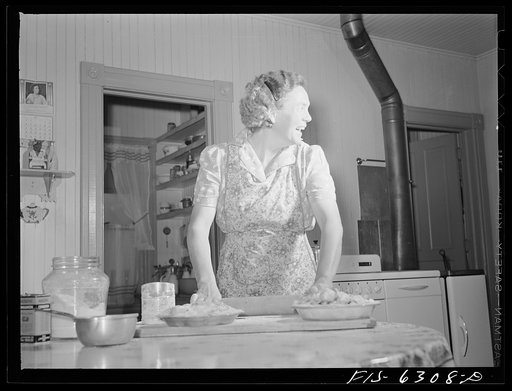 Untitled photo, possibly related to: Vernon County, Wisconsin. Mrs. Saugstad about to bake a pie in her electric oven
