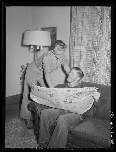 Vernon County, Wisconsin. Robert and a hired man discussing news in the parlor after dinner