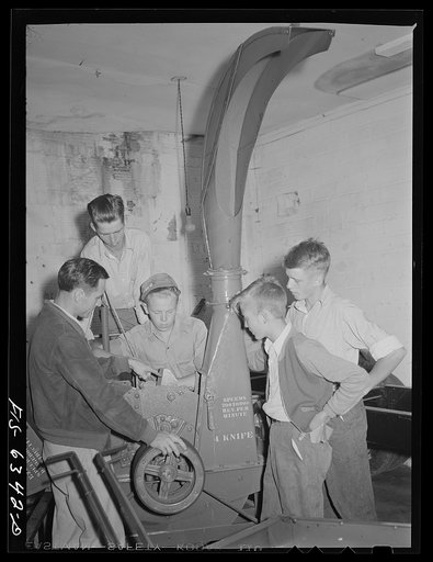 Untitled photo, possibly related to: Vernon County, Wisconsin. Robert Saugstad with the Future Farmers of America (FFA) group studying the new Farmall tractor