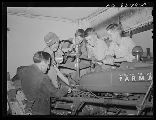 Vernon County, Wisconsin. Robert Saugstad with the Future Farmers of America (FFA) group studying the new Farmall tractor