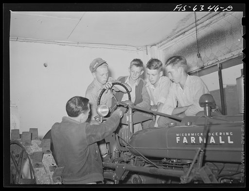 Untitled photo, possibly related to: Vernon County, Wisconsin. Robert Saugstad with the Future Farmers of America (FFA) group studying the new Farmall tractor