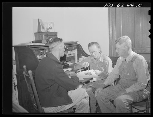 Untitled photo, possibly related to: Vernon County, Wisconsin. Edward Saugstad discussing conservation plans with other members of the Agricultural Adjustment Administration committee