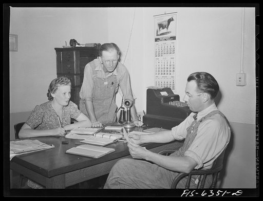 Westby, Vernon County, Wisconsin. Edward Saugstad, president of the cooperative creamery discussing business with the manager and secretary