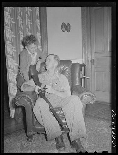 Vernon County, Wisconsin. Edward Saugstad showing son Teddy how to operate a new rifle