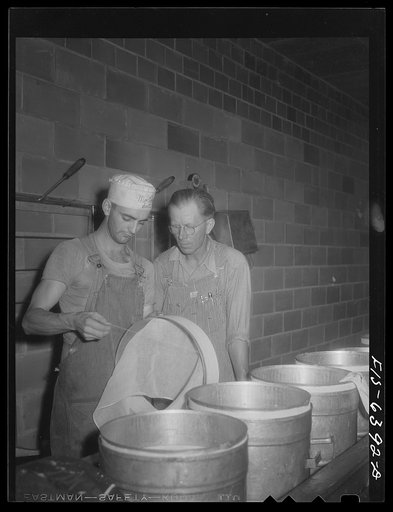 Westby, Vernon County, Wisconsin. Cheesemaker showing Saugstad how cheesecloth is applied at the cooperative creamery