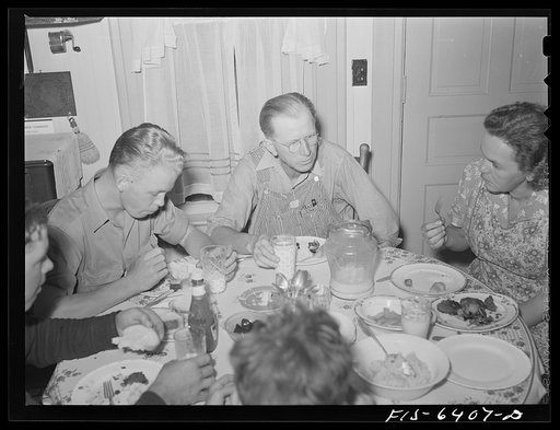 Untitled photo, possibly related to: Vernon County, Wisconsin. Saugstad family at dinner. Left to right: Teddy. Aged ten; Alton Lee, hired man; Robert, aged sixteen, Mr. and Mrs. Saugstad