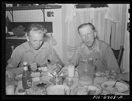Untitled photo, possibly related to: Vernon County, Wisconsin. Saugstad family at dinner. Left to right: Teddy. Aged ten; Alton Lee, hired man; Robert, aged sixteen, Mr. and Mrs. Saugstad