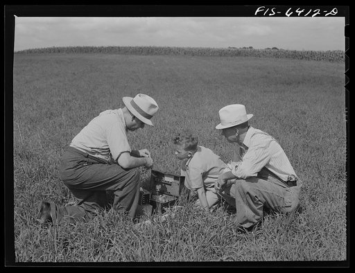 Untitled photo, possibly related to: Vernon County, Wisconsin. Saugstad and son Teddy watching the soil tester at work. Frequent tests of this kind maintain soil fertility