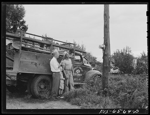 Hayti, Missouri. President of the U.S. Rural Electrification Administration (REA) cooperative with a lineman