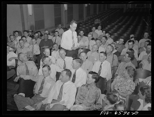 Untitled photo, possibly related to: Hayti, Missouri. Manager of the U.S. Rural Electrification Administration (REA) cooperative speaking to members at the annual meeting