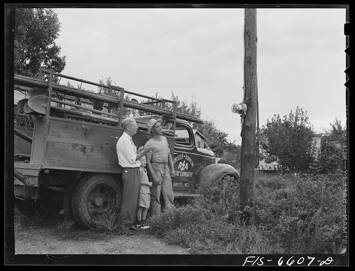 Untitled photo, possibly related to: Hayti, Missouri. Erecting a new pole on a U.S. Rural Electrification Administration (REA) line
