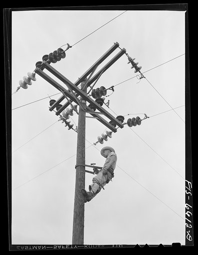 Untitled photo, possibly related to: Hayti, Missouri. U.S. Rural Electrification Administration (REA) cooperative lineman