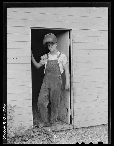 Untitled photo, possibly related to: Dunklin County, Missouri. Farm boy using welding equipment with U.S. Rural Electrification Administration (REA) power