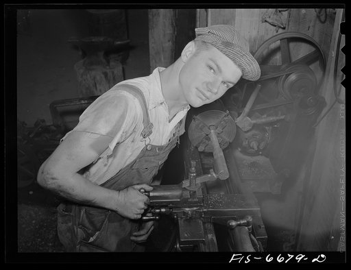 Dunklin County, Missouri. Farm boy using a lathe operated by U.S. Rural Electrification Administration (REA) power