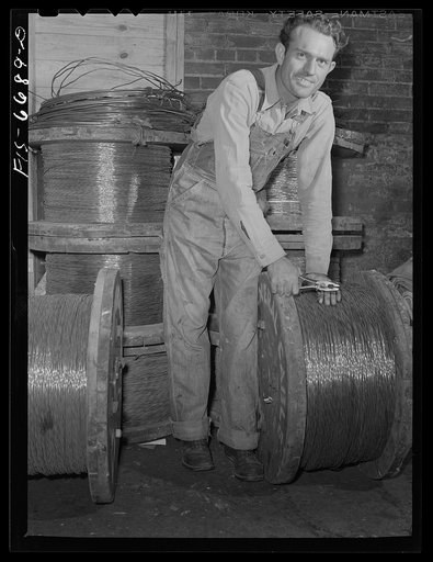 Hayti, Missouri. U.S. Rural Electrification Administration (REA) lineman with copper wire