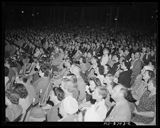 Interlochen, Michigan. National music camp where 300 or more young musicians study symphonic music for eight weeks each summer. Part of the crowd at a night performance of the symphony orchestra