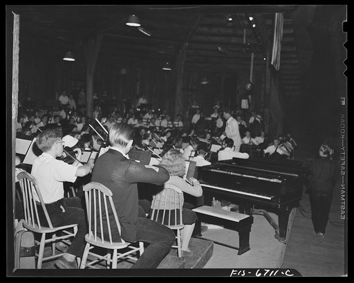 Untitled photo, possibly related to: Interlochen, Michigan. National music camp where 300 or more young musicians study symphonic music for eight weeks each summer. Chorus practicing hymns early Sunday morning