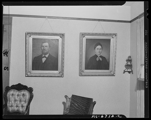 Frankfort, Michigan. Portraits of Mr. and Mrs. Muehlman who made money in a drugstore in Pekin, Illinois and went to Paris in 1879, where an artist by the name of Loomis painted these portraits