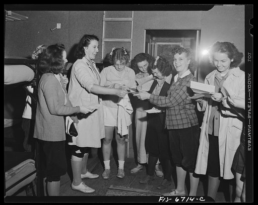Interlochen, Michigan. National music camp where 300 or more young musicians study symphonic music for eight weeks each summer. Girls receiving mail in their cabin