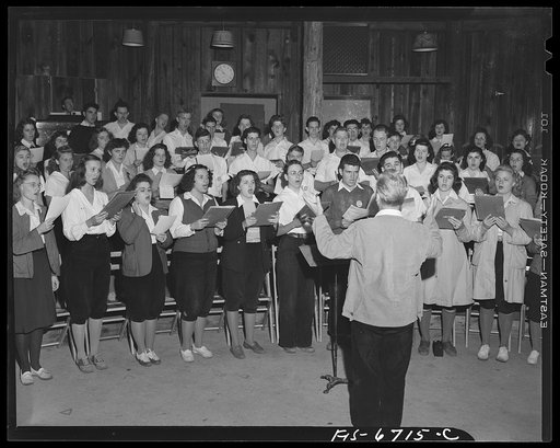 Interlochen, Michigan. National music camp where 300 or more young musicians study symphonic music for eight weeks each summer. Chorus broadcasting hymns on Sunday morning