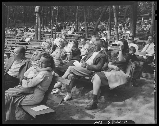 Interlochen, Michigan. National music camp where 300 or more young musicians study symphonic music for eight weeks each summer. Crowd listening to a rehearsal