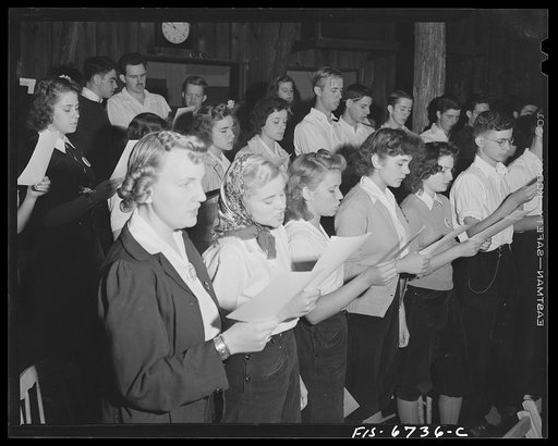 Interlochen, Michigan. National music camp where 300 or more young musicians study symphonic music for eight weeks each summer. Girl singing in a chorus