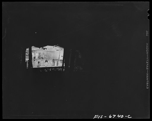 Untitled photo, possibly related to: Interlochen, Michigan. National music camp where 300 or more young musicians study symphonic music for eight weeks each summer. Long shot of stage at night at the performance of "Pirates of Penzance"