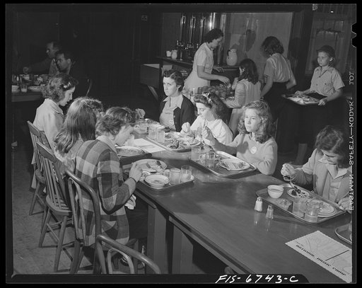 Interlochen, Michigan. National music camp where 300 or more young musicians study symphonic music for eight weeks each summer. Girls eating lunch