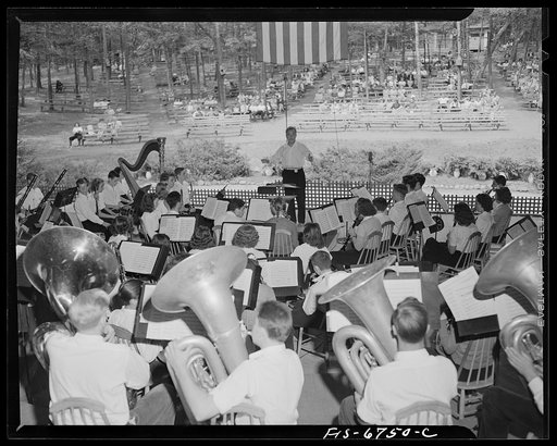 Interlochen, Michigan. National music camp where 300 or more young musicians study symphonic music for eight weeks each summer. Symphony orchestra practicing