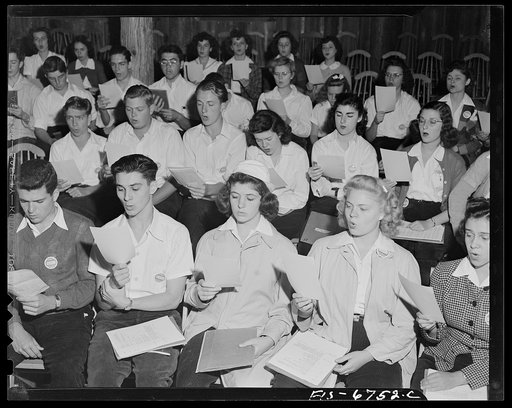 Interlochen, Michigan. National music camp where 300 or more young musicians study symphonic music for eight weeks each summer. Chorus practicing hymns early Sunday morning
