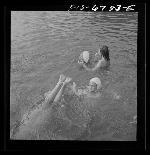 Interlochen, Michigan. National music camp where 300 or more young musicians study symphonic music for eight weeks each summer. Girls swimming during the recreation period
