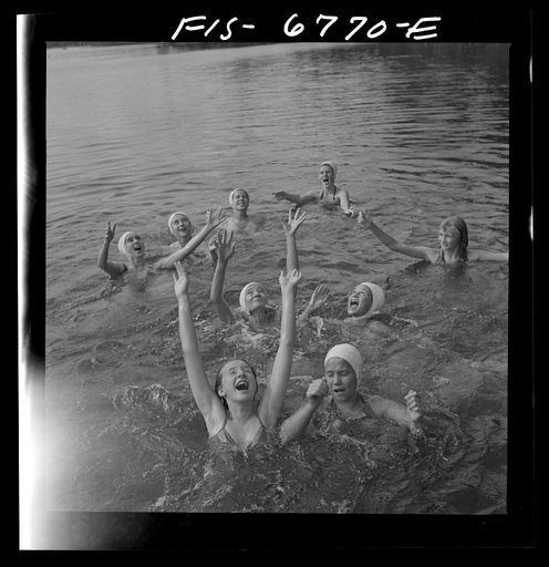 Interlochen, Michigan. National music camp where 300 or more young musicians study symphonic music for eight weeks each summer. Girls waiting to catch large rubber ball
