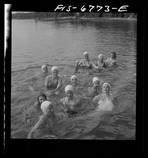 Interlochen, Michigan. National music camp where 300 or more young musicians study symphonic music for eight weeks each summer. Portrait of girl in swimming