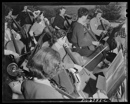 Interlochen, Michigan. National music camp where 300 or more young musicians study symphonic music for eight weeks each summer. Cello section of symphony orchestra
