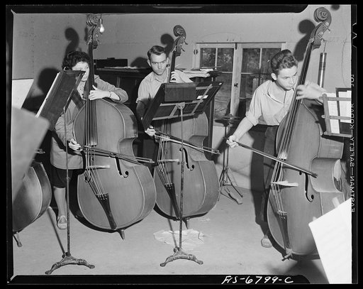 Interlochen, Michigan. National music camp where 300 or more young musicians study symphonic music for eight weeks each summer. Practice indoors on string instruments
