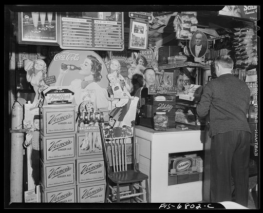Interlochen, Michigan. National music camp where 300 or more young musicians study symphonic music for eight weeks each summer. Soft drink and beer signs at beer parlor near camp