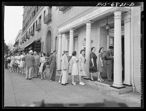 Washington, D.C. Line outside Scholl's cafeteria on Connecticut Avenue at six p.m. Over 100 people stand in line and are served at the rate of one every minute