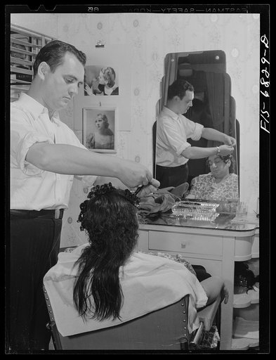 New York, New York. Undoing a permanent hair wave at Francois de Paris, a hairdresser on Eighth Street