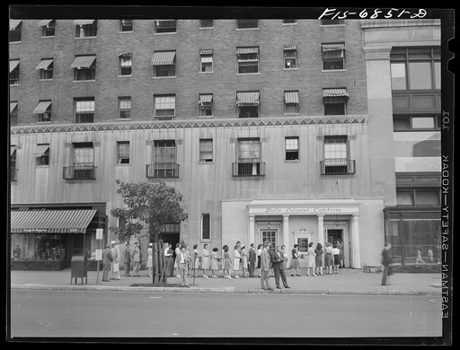 Washington, D.C. Line outside Scholl's cafeteria on Connecticut Avenue, at six p.m. Over 100 people stand in line and are served at the rate of one every minute