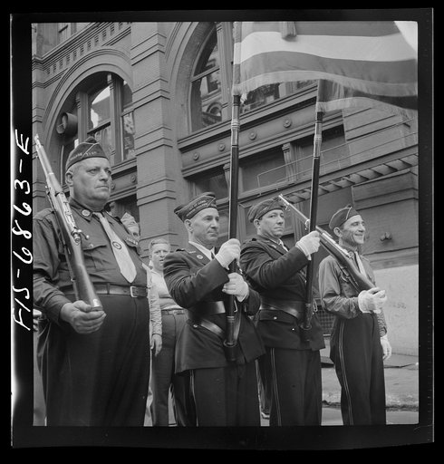 New York, New York. Italian-American Legionnaries marching in a parade on Mott Street, at the Feast of San Rocco (August 16) which ended in a flag raising ceremony in honor of the boys of the neighborhood who were in the United States Army