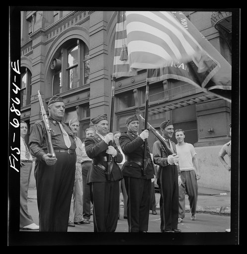 Untitled photo, possibly related to: New York, New York. Italian-American Legionnaries marching in a parade on Mott Street, at the Feast of San Rocco (August 16) which ended in a flag raising ceremony in honor of the boys of the neighborhood who were in the United States Army