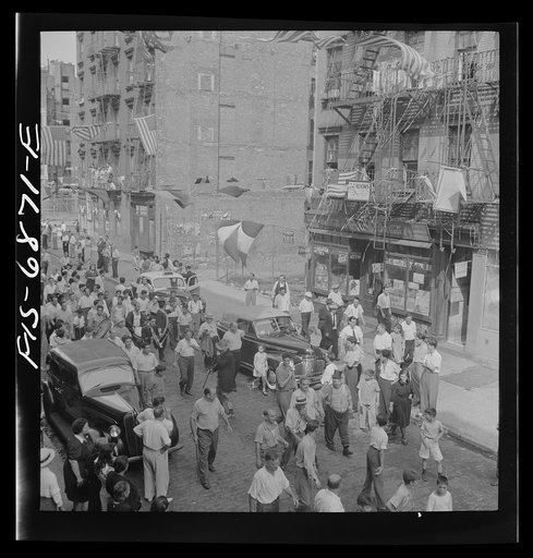 Untitled photo, possibly related to: New York, New York. Parade of Italian-Americans on Mott Street at a flag raising ceremony in honor of neighborhood boys in the United States Army