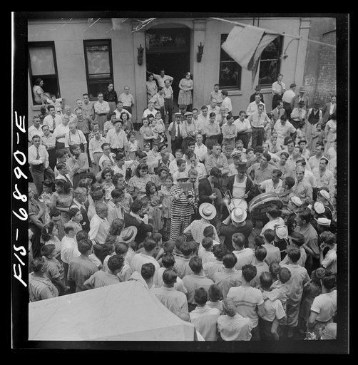 Untitled photo, possibly related to: New York, New York. Dancing and music on Mott Street, at a flag raising ceremony in honor of neighborhood boys in the United States Army