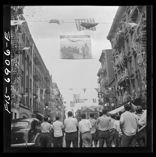 New York, New York. Flag raising ceremony in the rain in honor of Mott Street boys in the United States Army