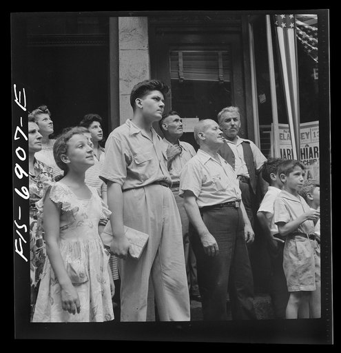 New York, New York. Italian-American in the rain watching a flag raising ceremony in honor of the feast of San Rocco at right