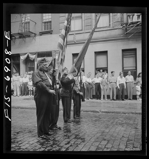 Untitled photo, possibly related to: New York, New York. Italian-American Legionnaries marching in a parade on Mott Street, at the Feast of San Rocco (August 16) which ended in a flag raising ceremony in honor of the boys of the neighborhood who were in the United States Army