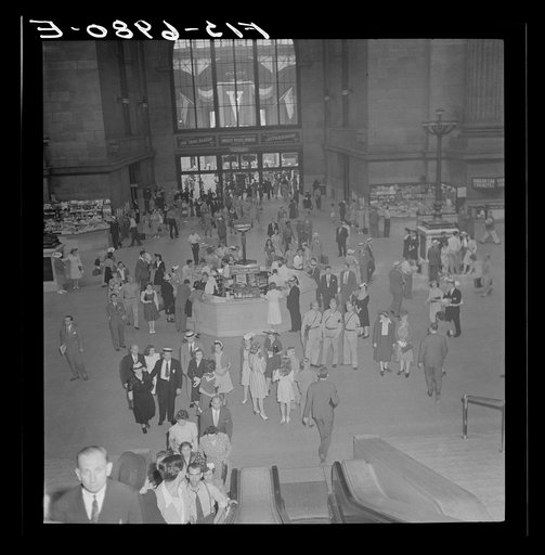 New York, New York. Information booth and escalators at the Pennsylvania railroad station